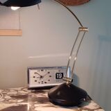 Articulated black and gold metal desk lamp