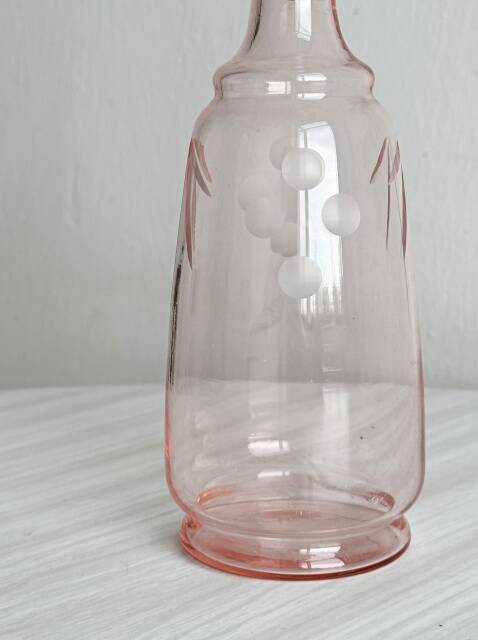 Antique translucent pink glass bottle