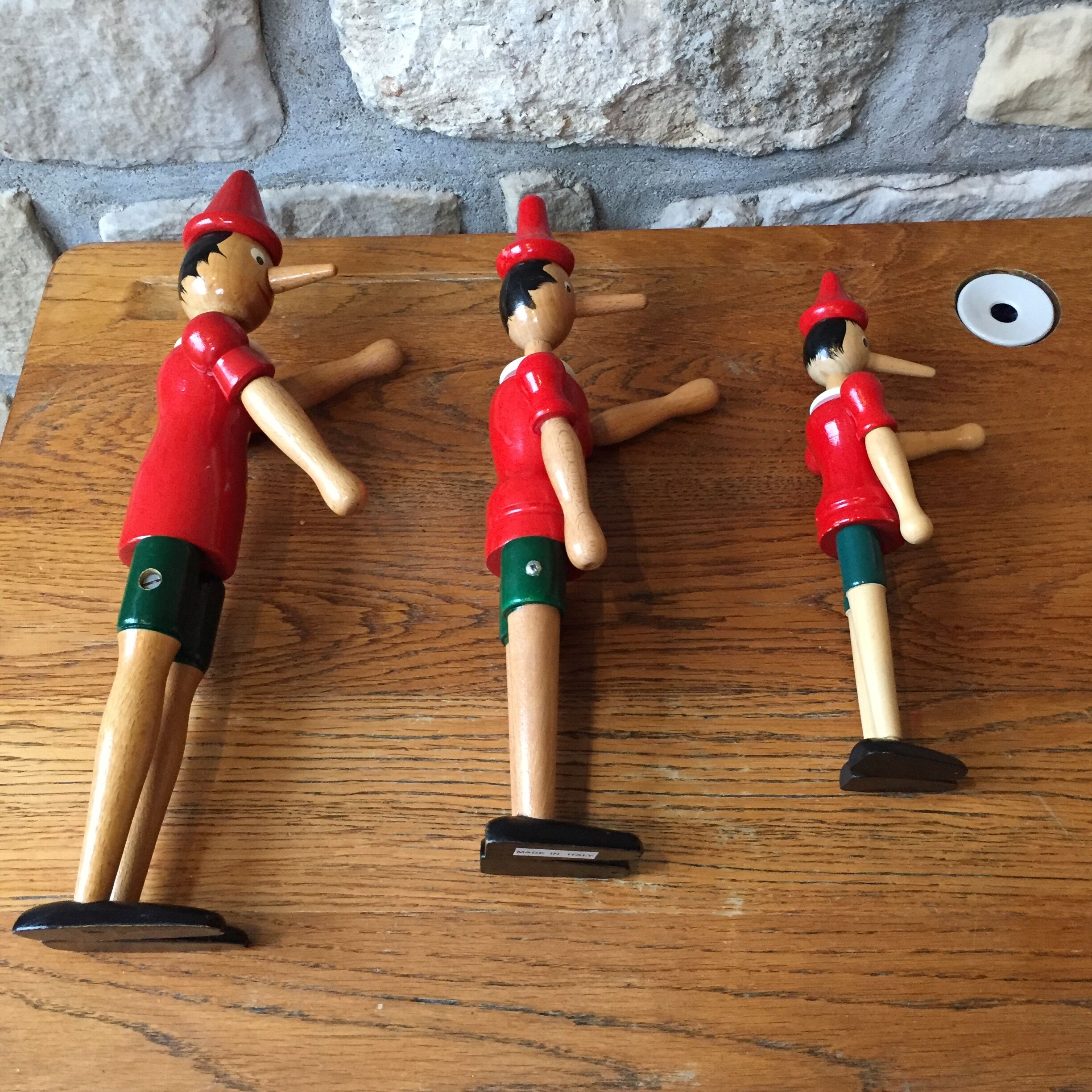 Trio of old wooden Pinocchio Made in Italy