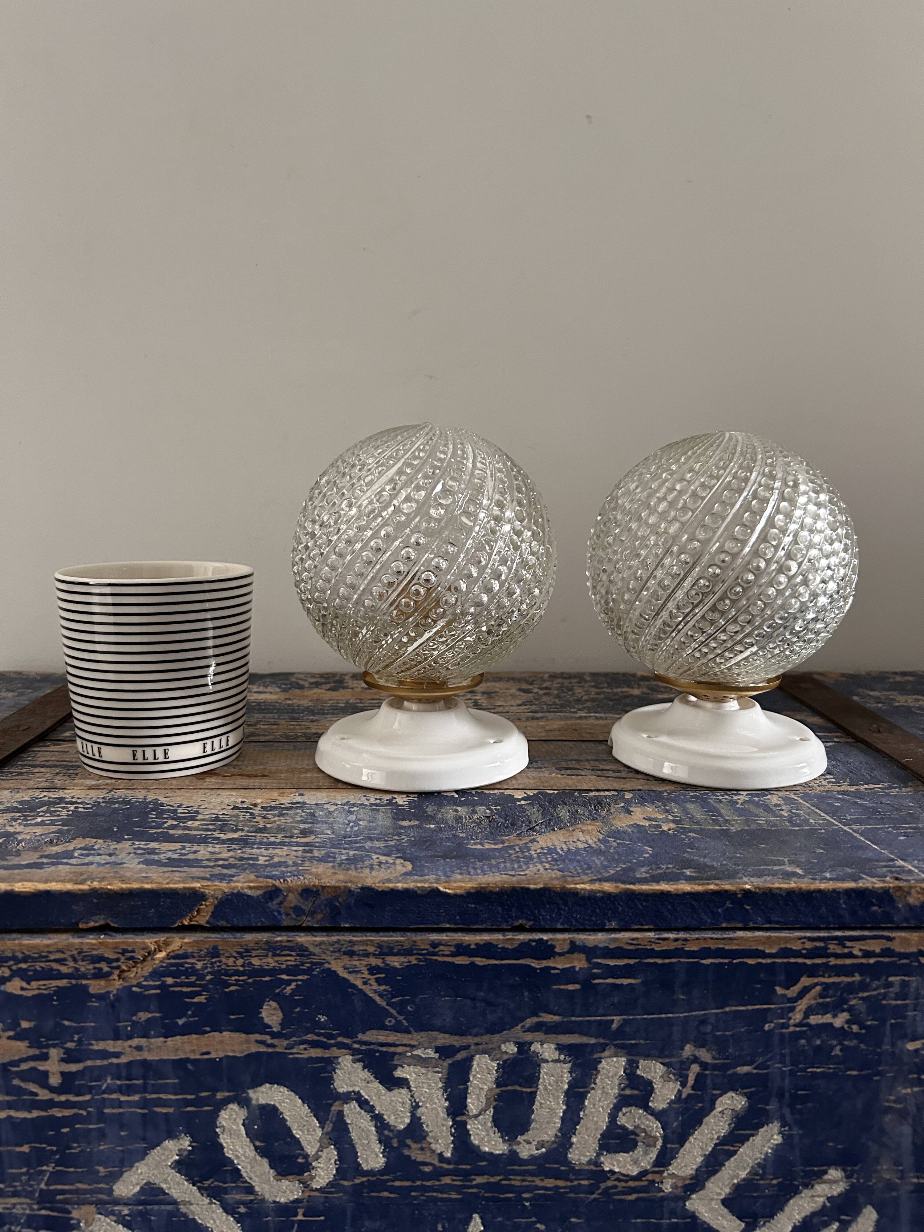 Set of two chiseled glass globe wall lights