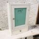 White medicine cabinet with window and drawer