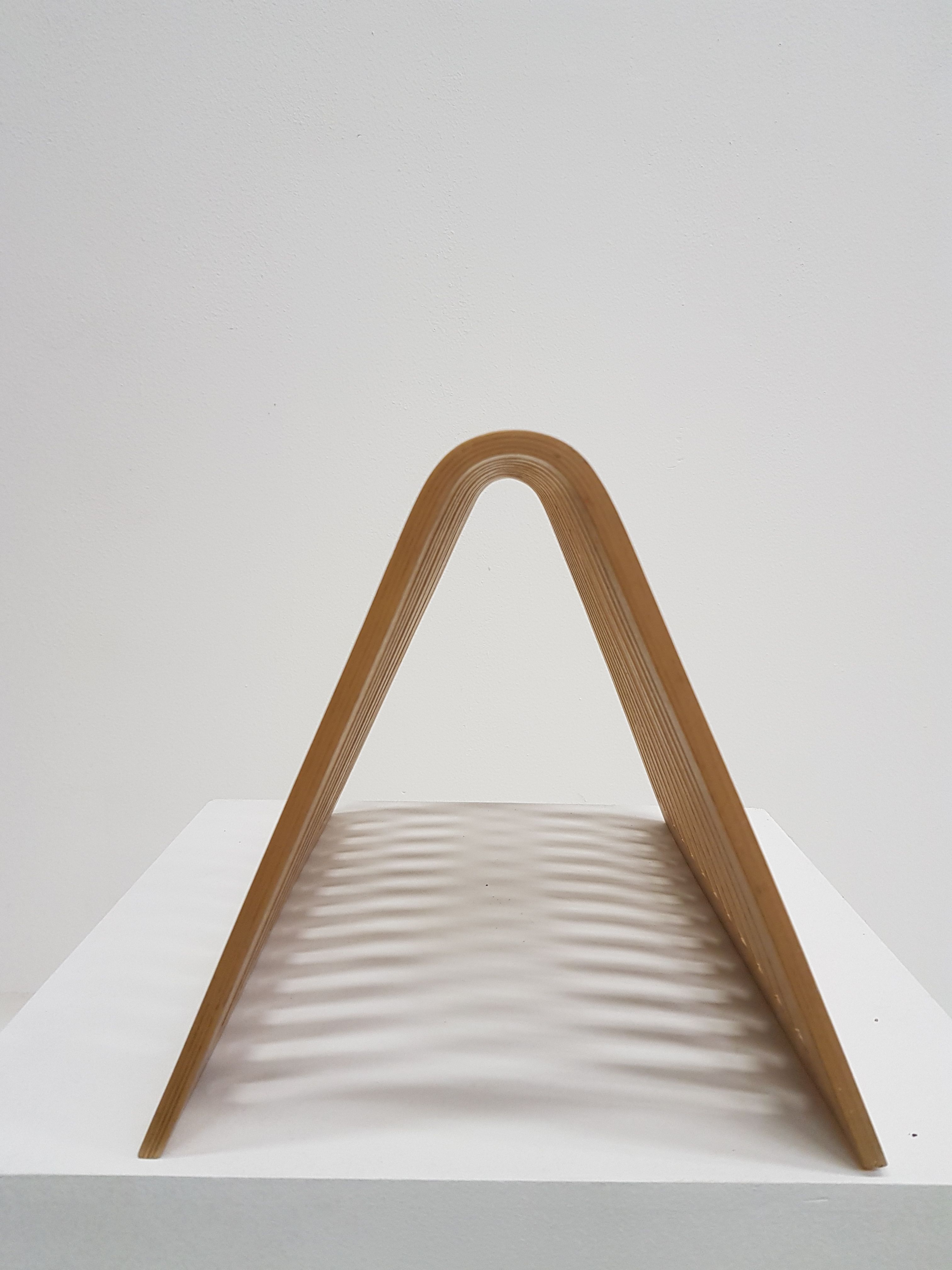 Vintage magazine rack in thermoformed wood from the 60s