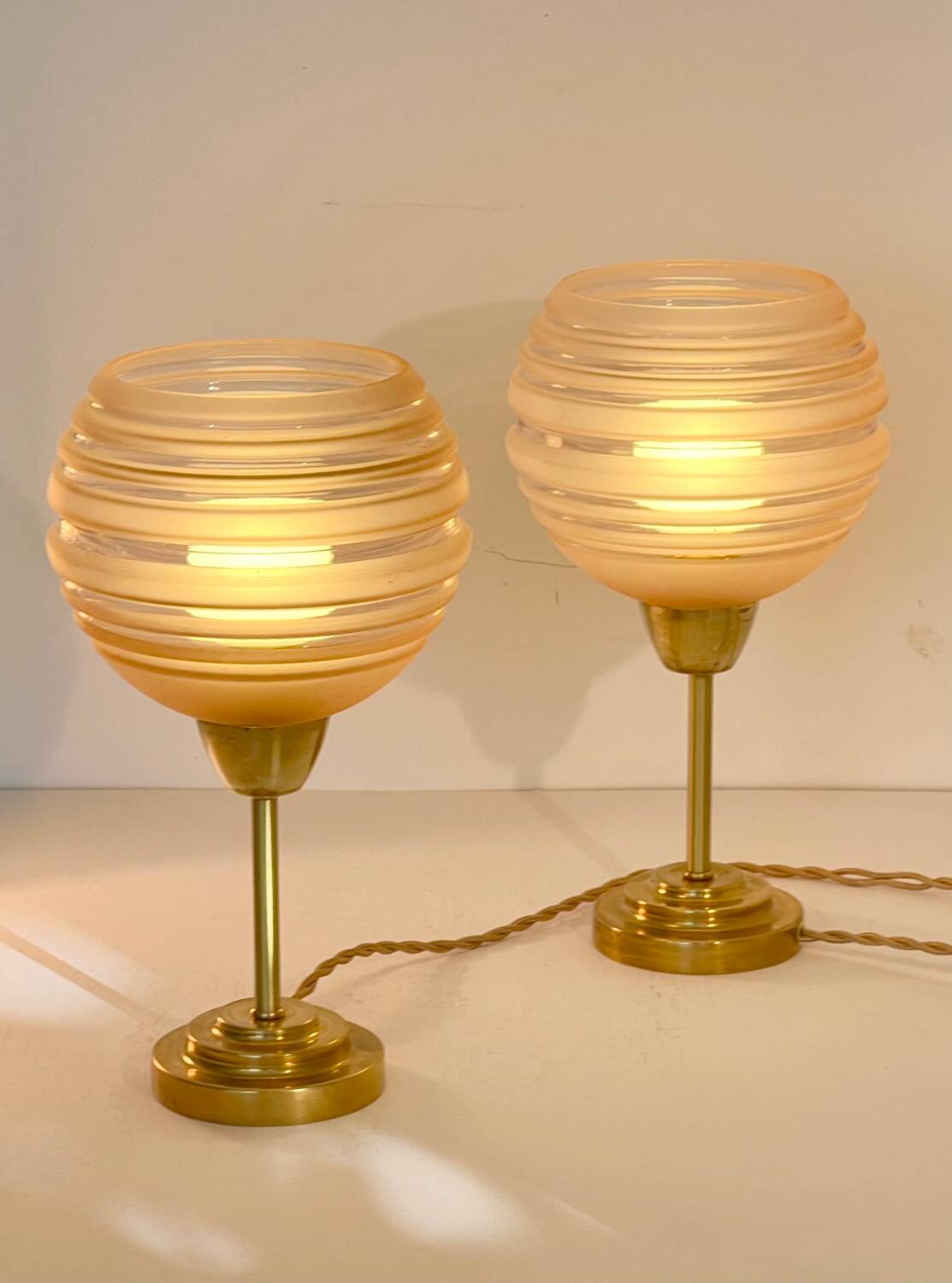 Pair of Art Deco bedside lamps in brass and etched glass