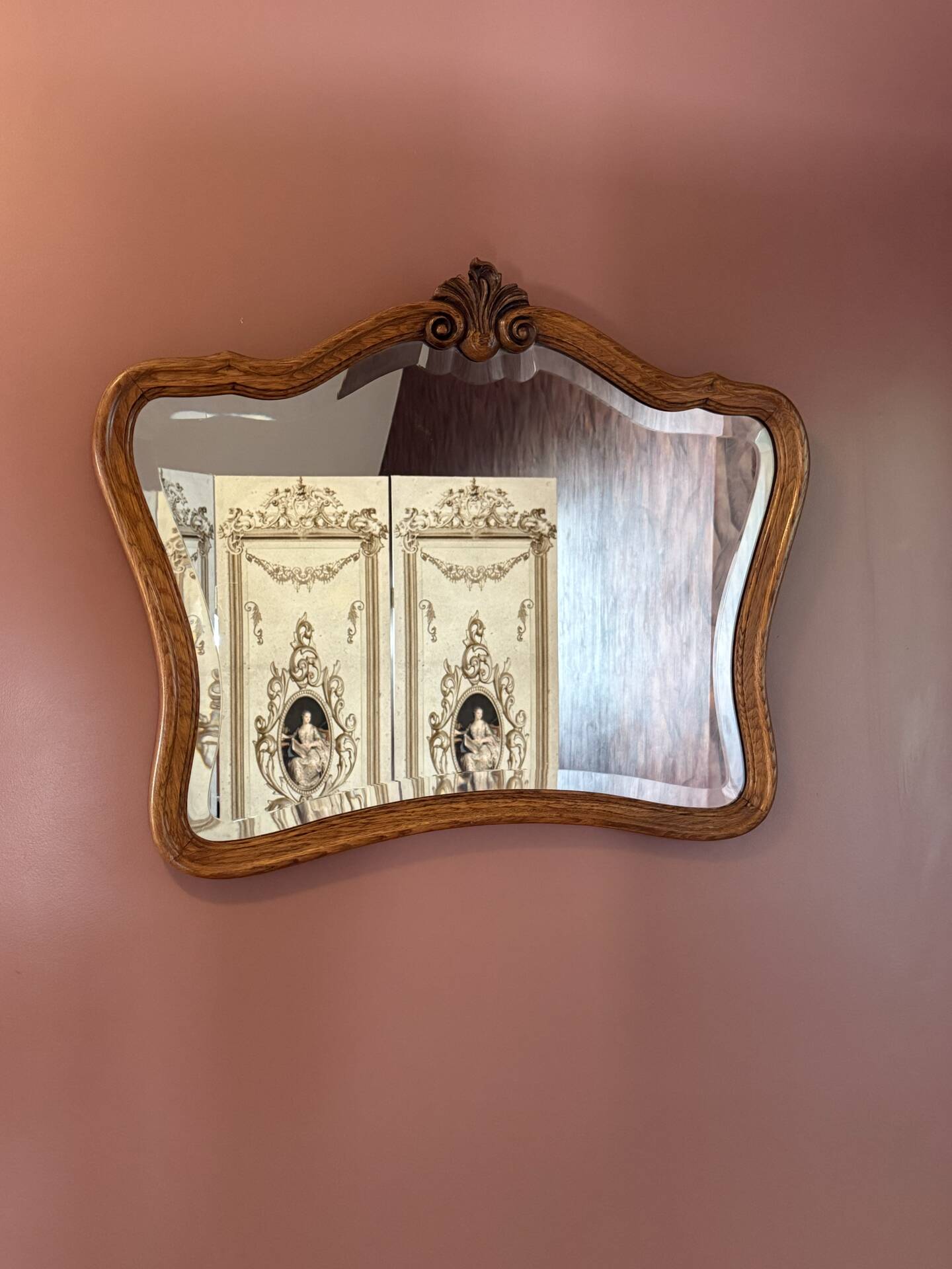 Antique bevelled mirror, oak frame