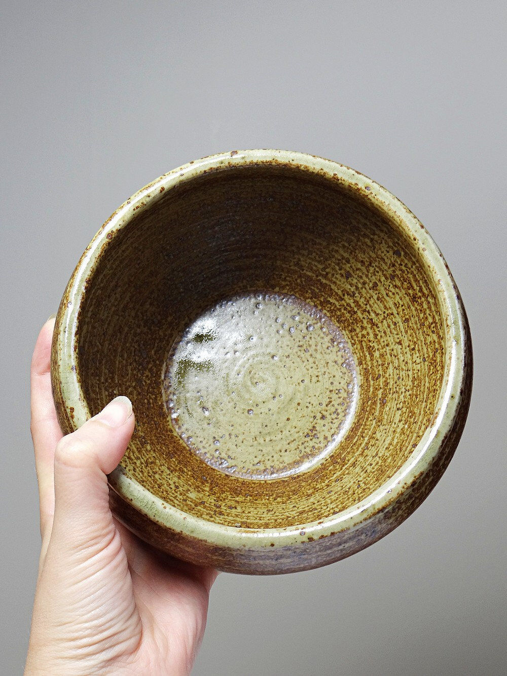 Vintage glazed stoneware bowl or planter in rustic wabi-sabi style.