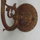 French Art Nouveau wall sconce in bronze with a white and pink glass shade.