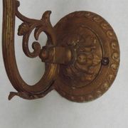 French Art Nouveau wall sconce in bronze with a white and pink glass shade.