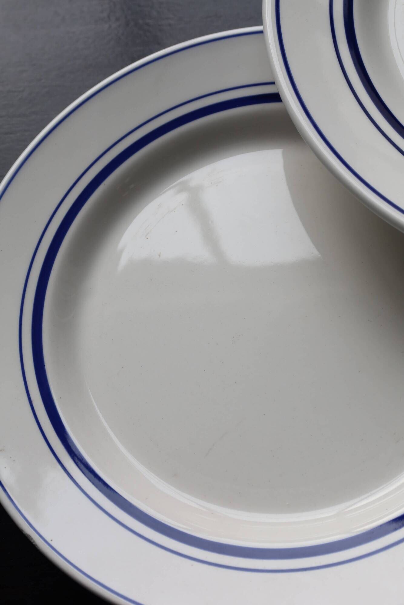 4 vintage bistro style flat plates in blue and white porcelain