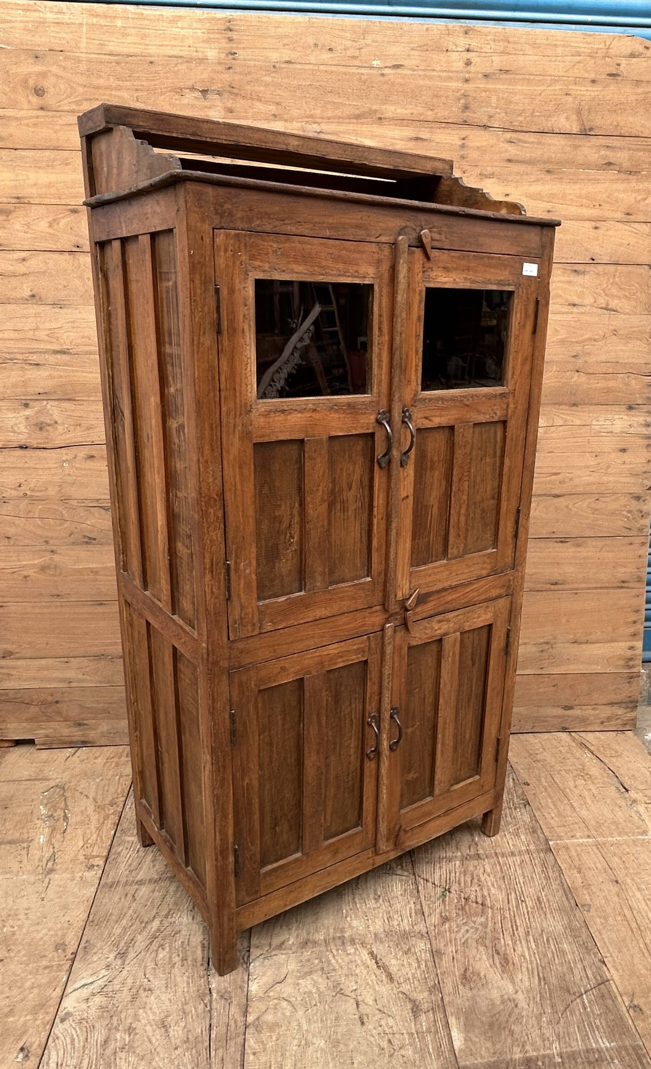 Art Deco glass-fronted cabinet in Burmese teak with original patina.