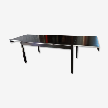 Blackened wooden dining table