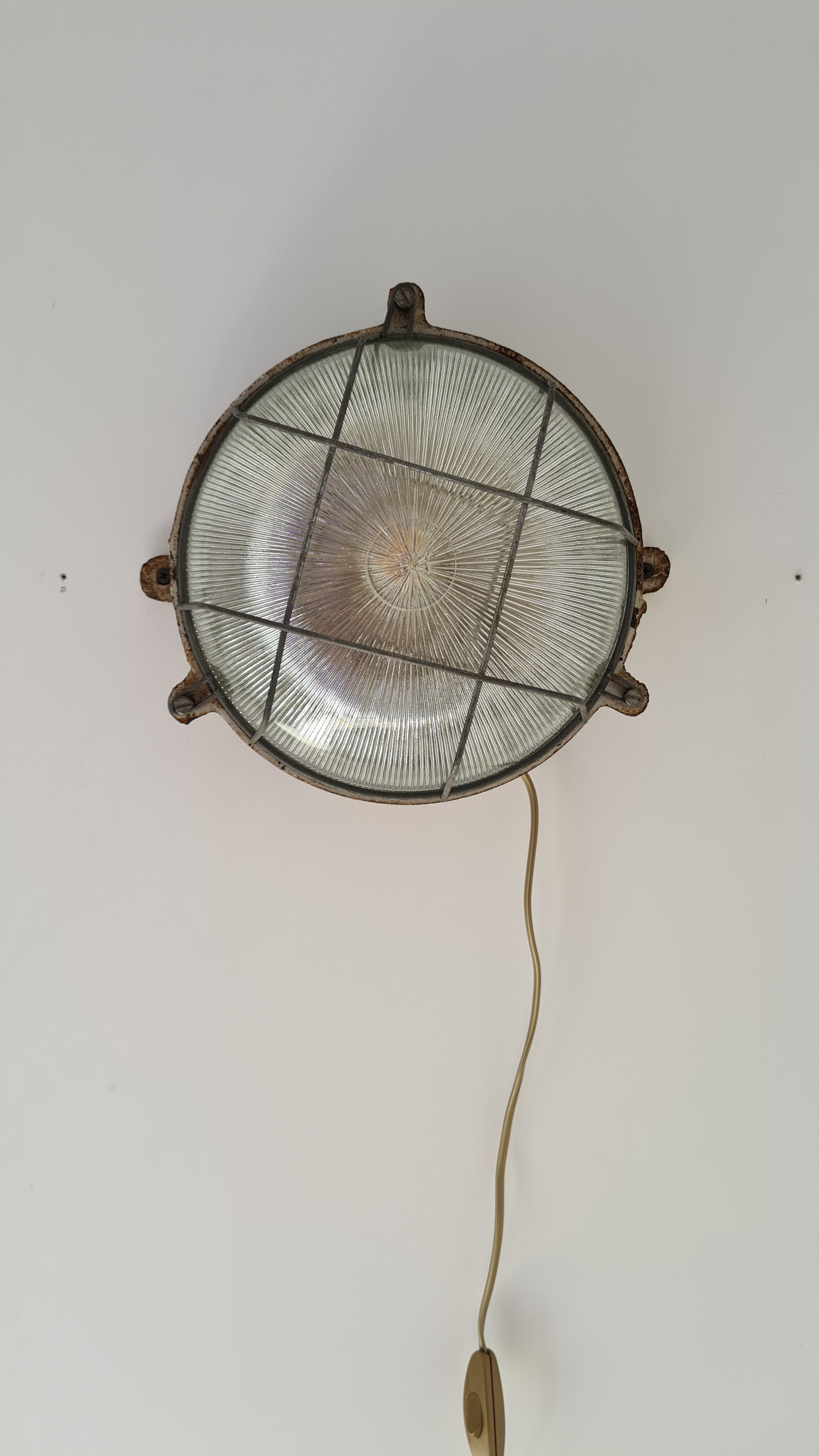 Cast iron porthole wall lamp by TH