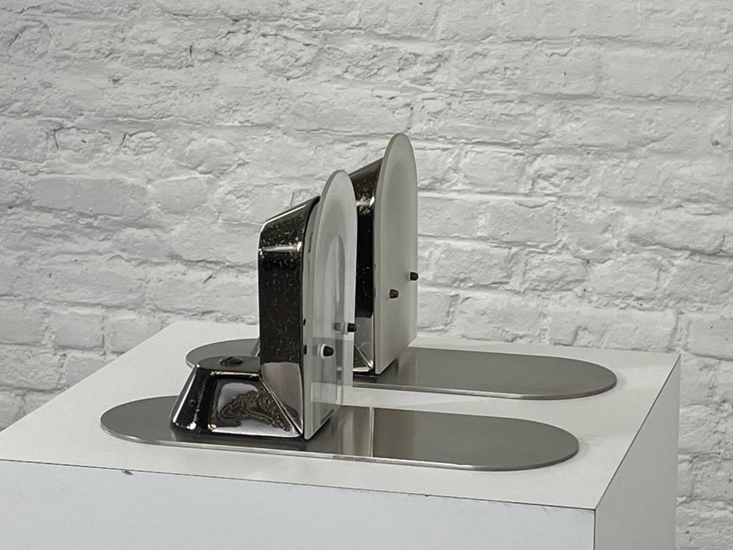 Pair of vintage stainless steel and glass wall lights