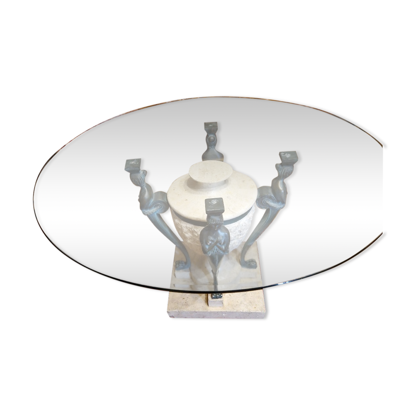 Stone and bronze dining table with ribbed glass top