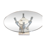 Stone and bronze dining table with ribbed glass top