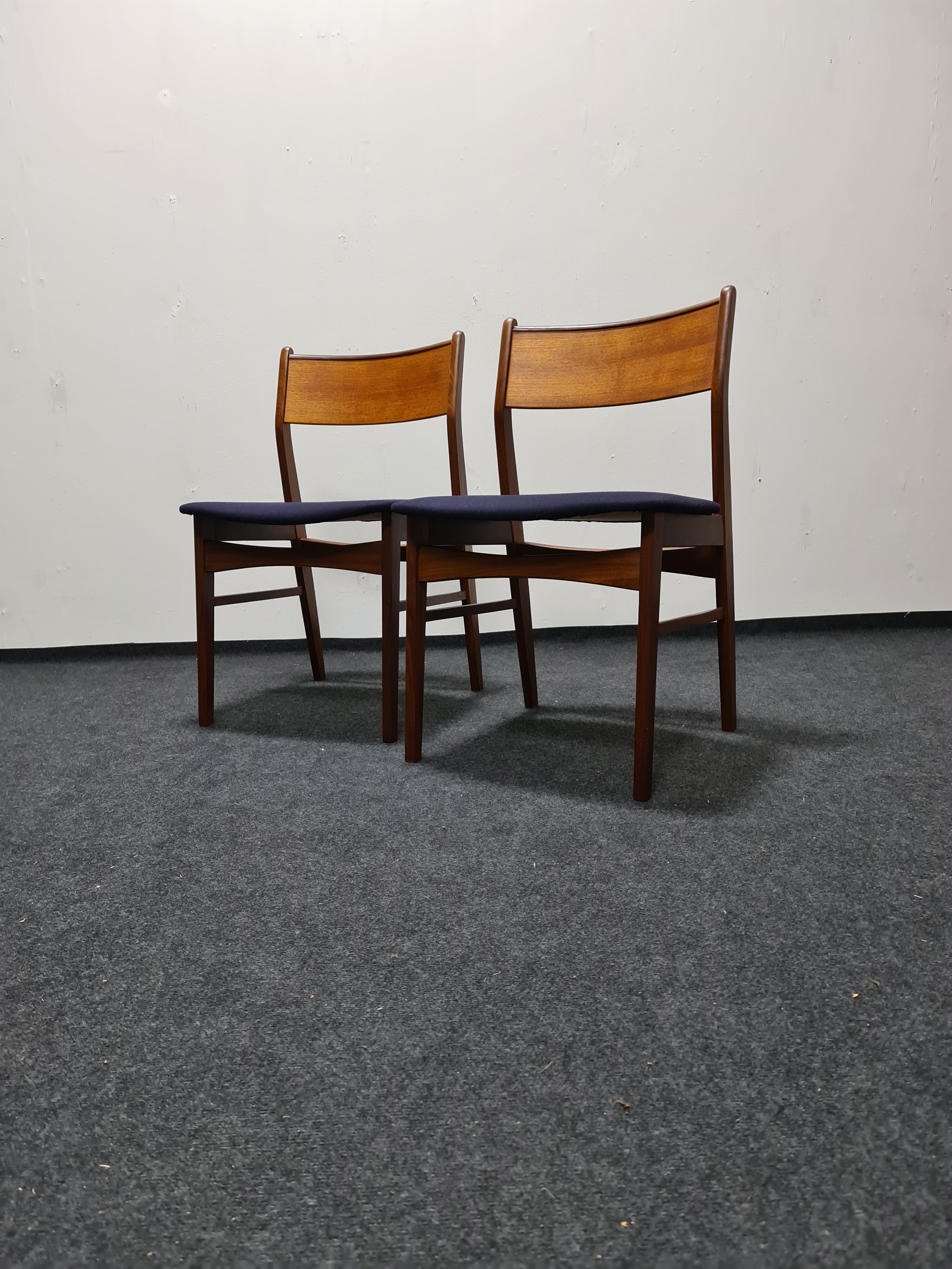 A pair of vintage teak dinning chairs