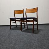 A pair of vintage teak dinning chairs