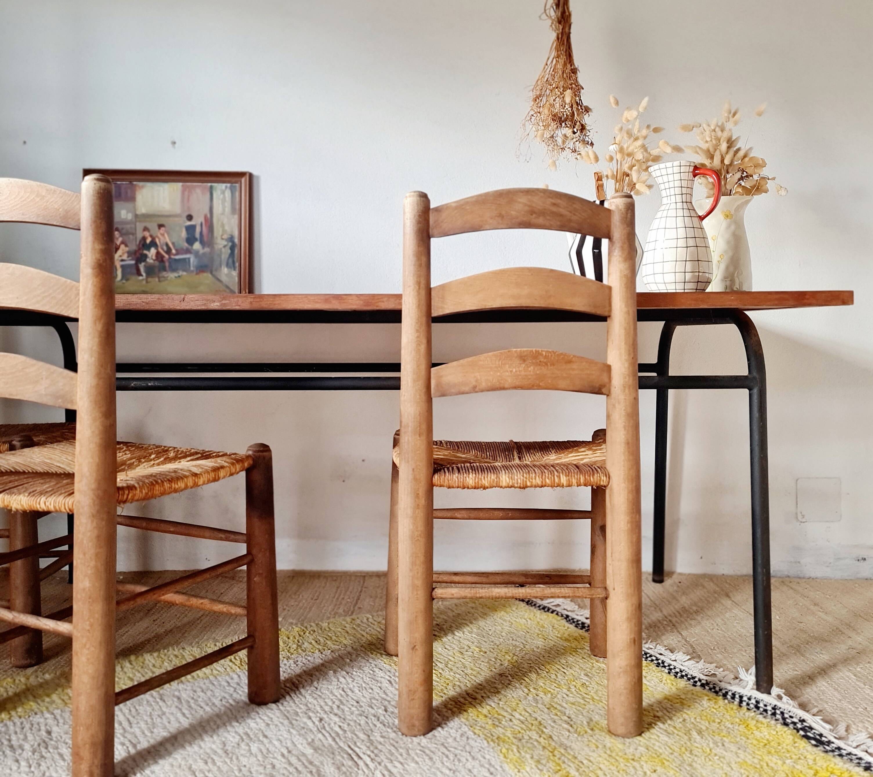 Table with tubular metal legs and wooden top.