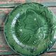 Pair of green slip plates with leaf decoration, 19th century