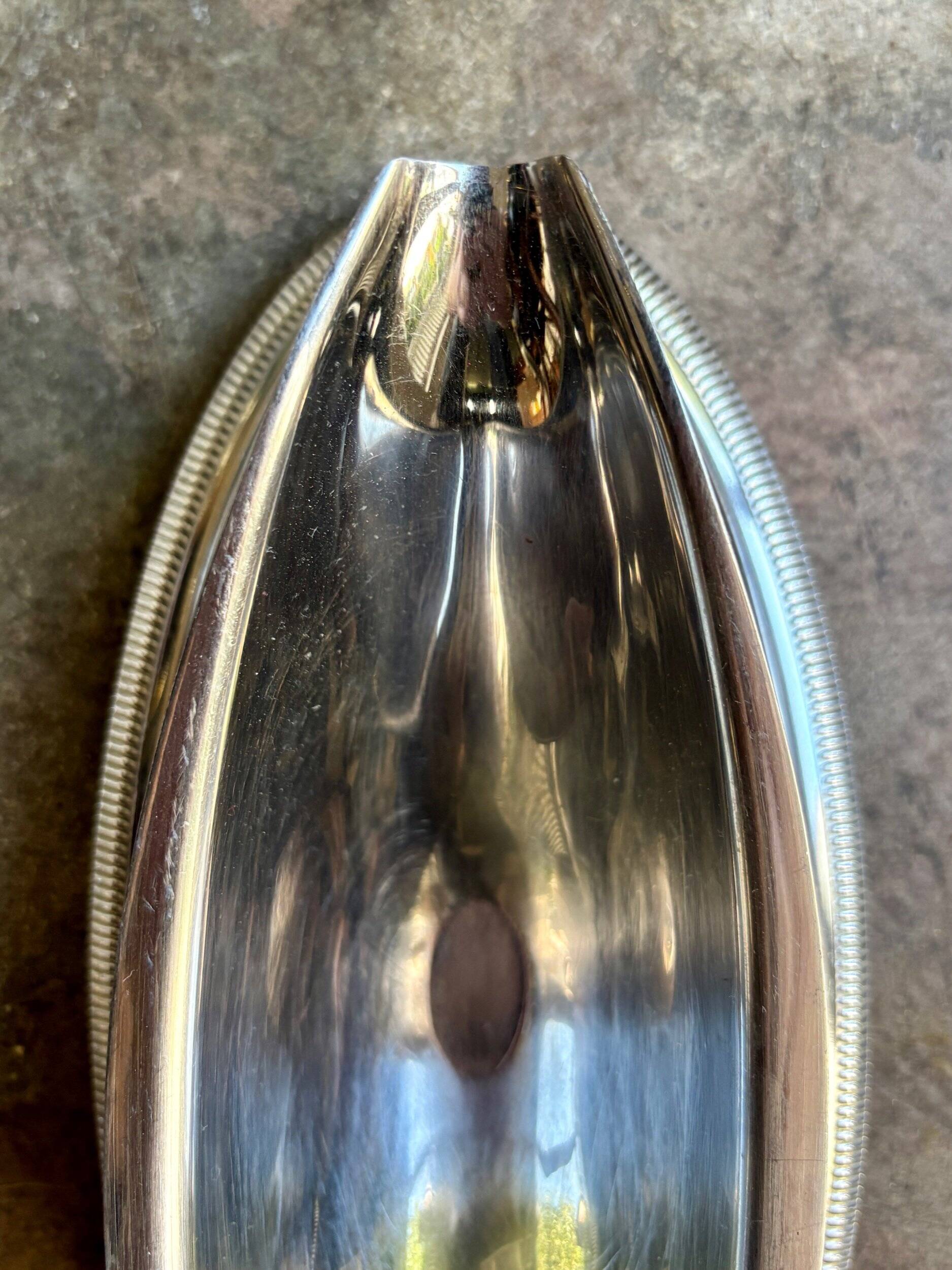 Silver stainless steel gravy boat