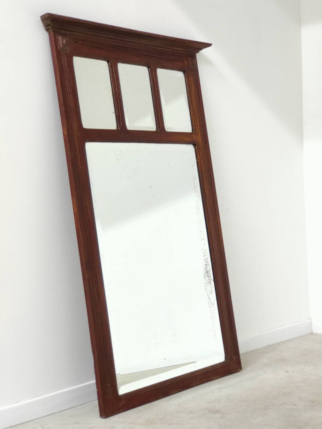 Antique beveled mirror on a wooden frame, 1930