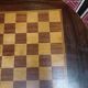 Pedestal table chessboard inlaid old pegs and staples