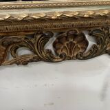Napoleon III style mirror in carved wood, 20th century.