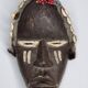Tribal Dan mask in wood and cowrie shells, West Africa, 27 cm