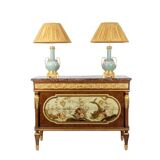 Empire style chest of drawers in lacquer, bronze and marble. Nineteenth century.