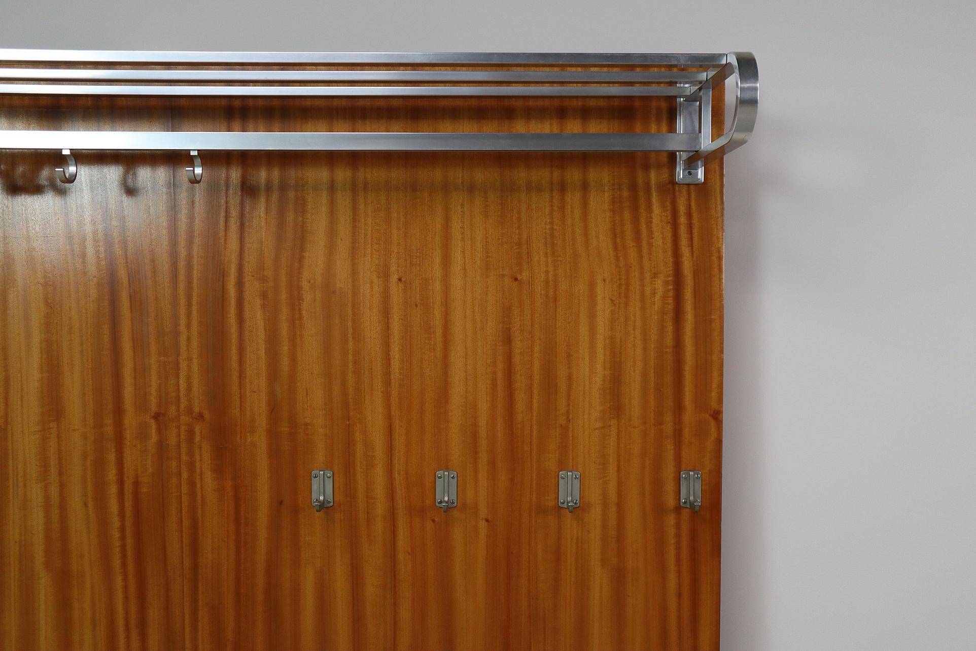 Modernist wall-mounted cloakroom in teak