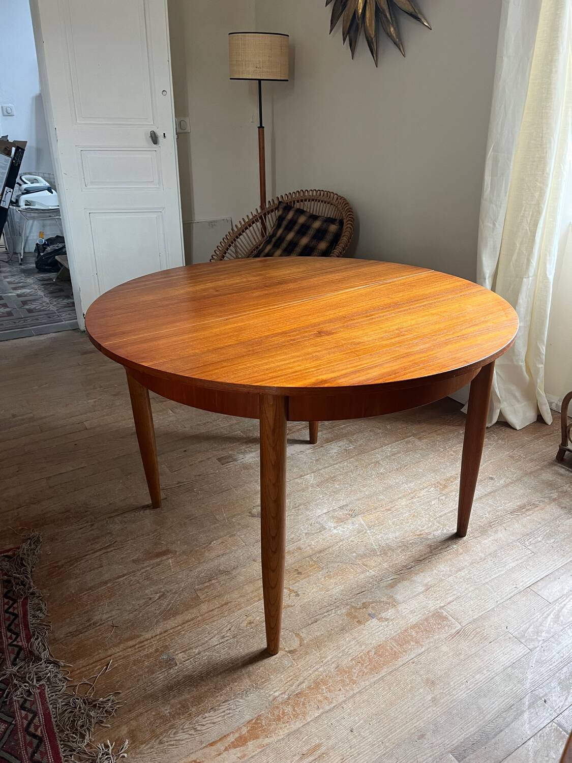 Scandinavian round teak table with butterfly extensions from the 60s