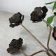 Rose shaped metal candle holder