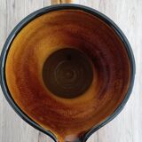 Orange glazed ceramic pitcher