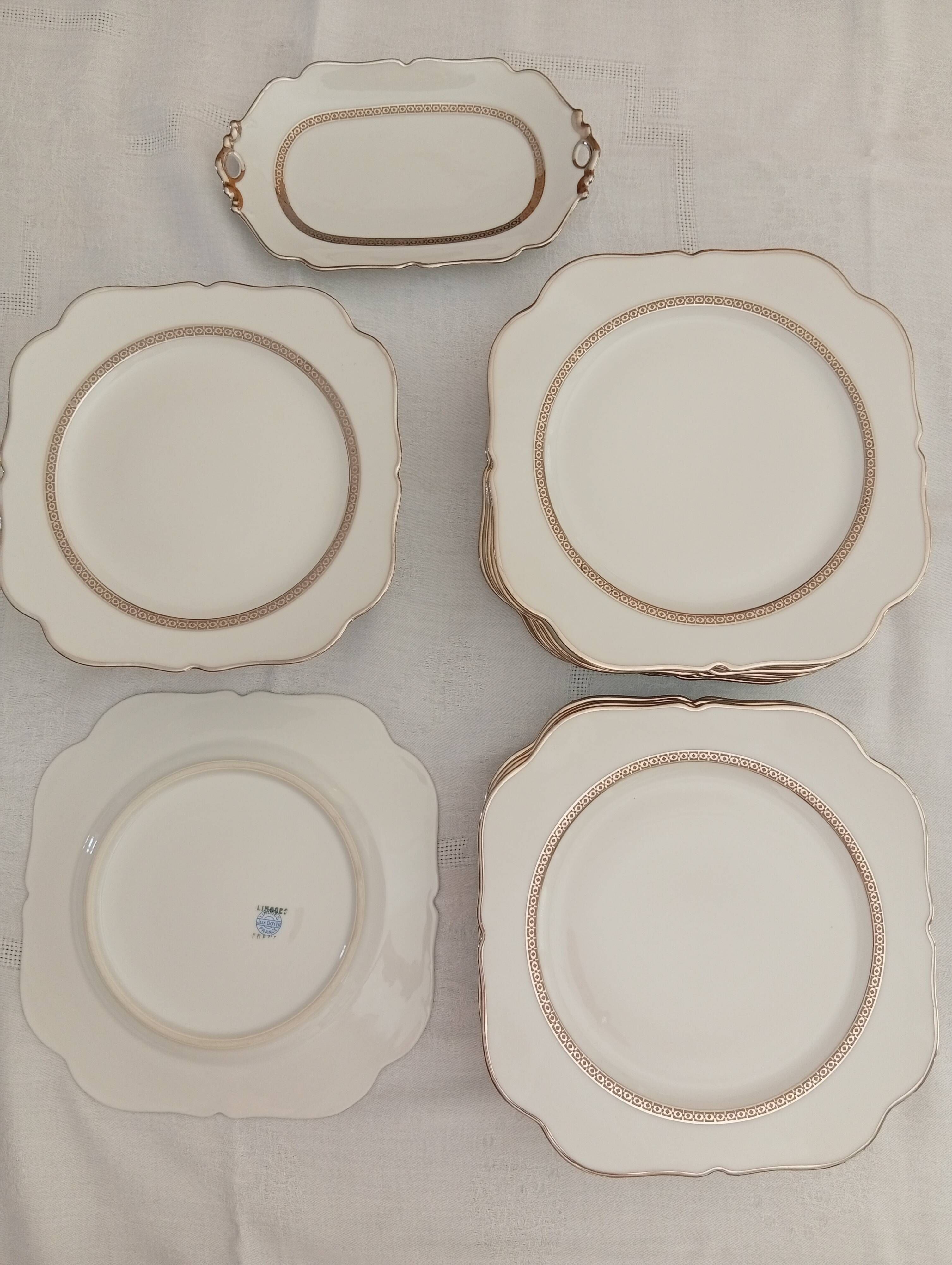 Jean BOYER Limoges FRANCE part of a white porcelain table service.
