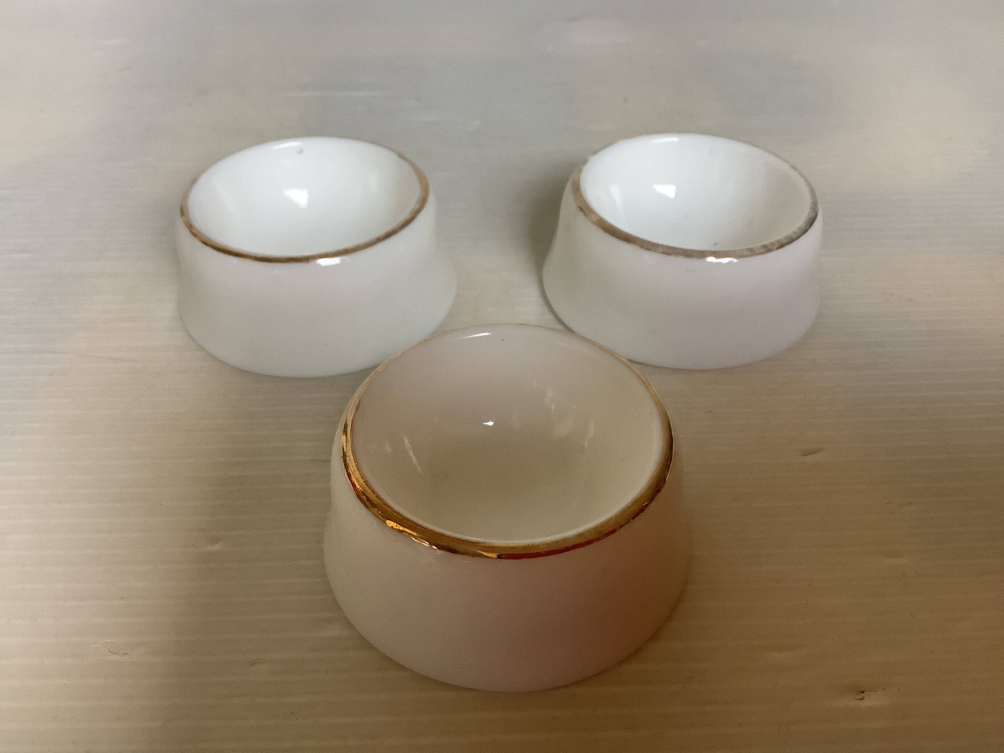 Set of three opaline egg cups