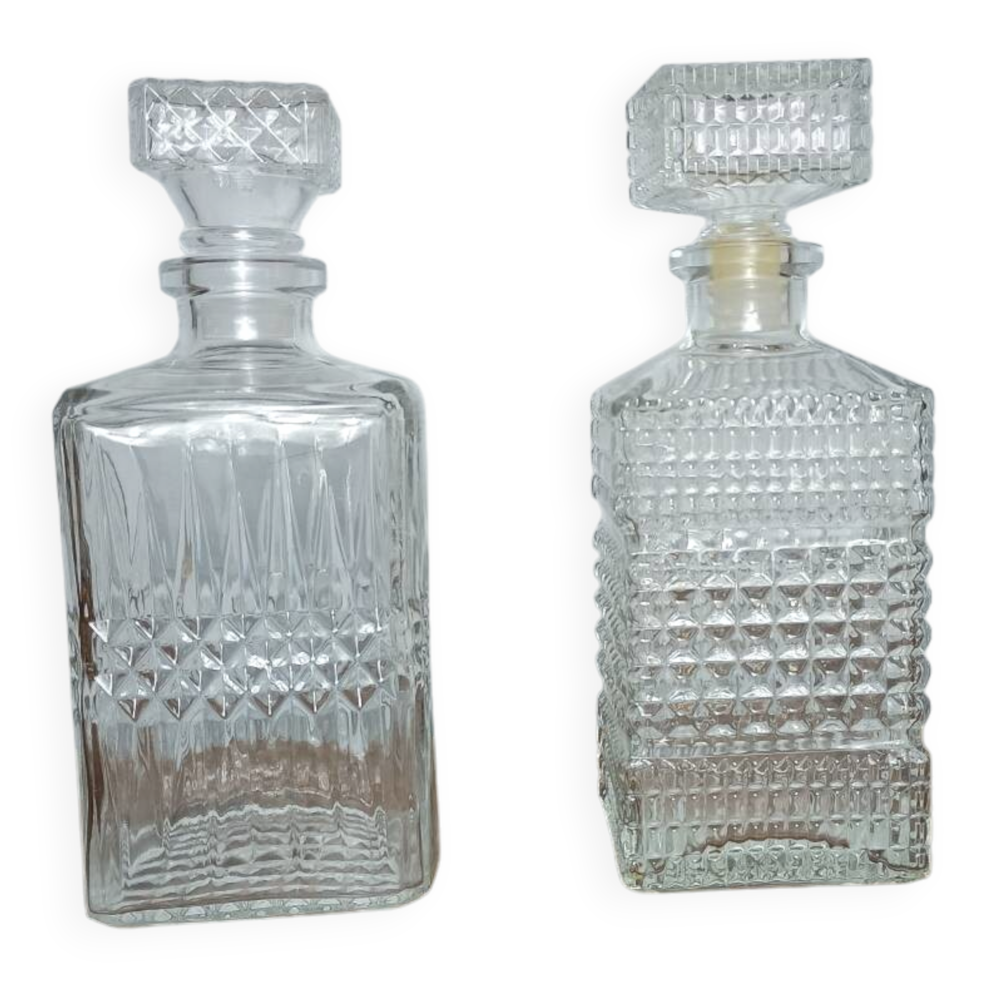 Mismatched pair of whisky decanters.