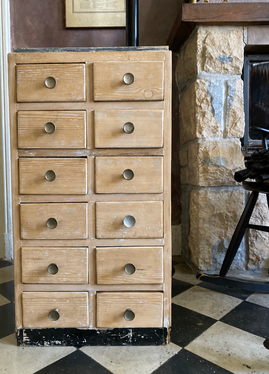Vintage antique workshop cabinet with 12 drawers in raw wood.