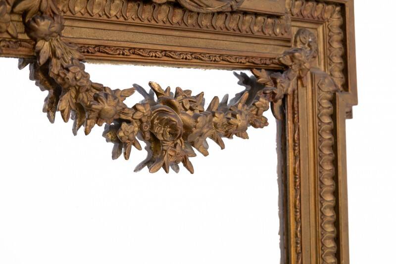 Large mirror in a gold frame, France.