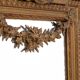Large mirror in a gold frame, France.