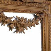 Large mirror in a gold frame, France.
