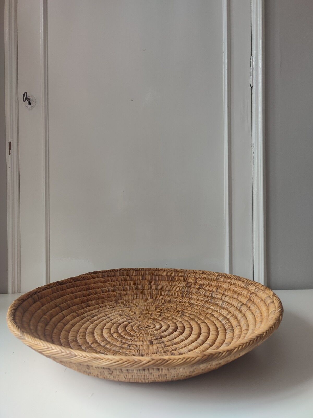 Ethnic plateau in woven palm leaf