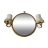 Round gilded mirror with integrated sconces