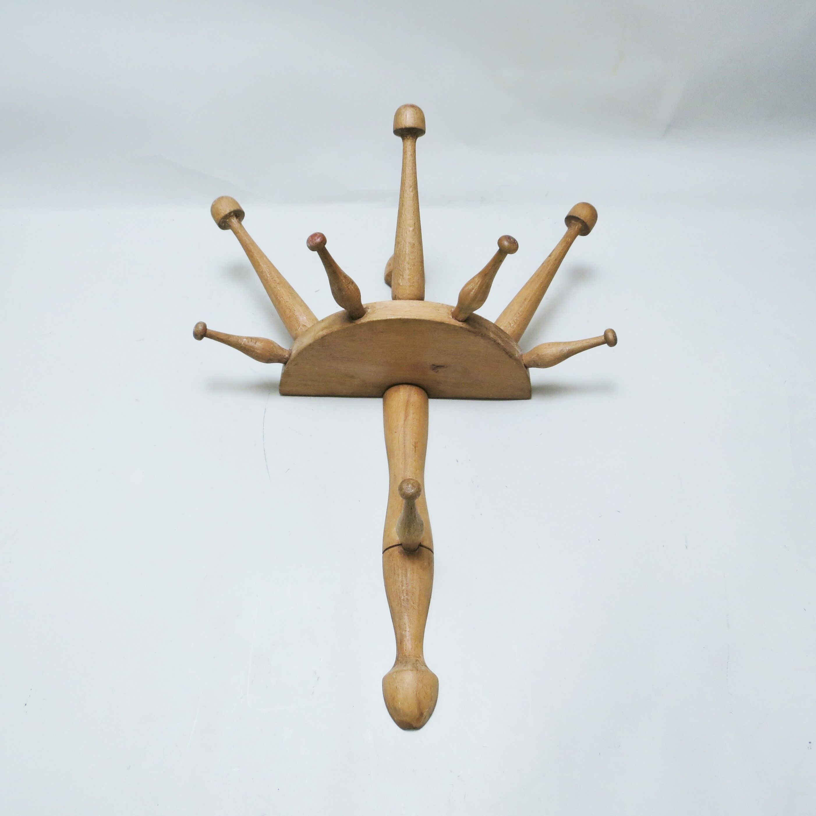 Turned wood wall coat rack