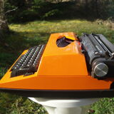 Electric writing machine adler orange and black with its suitcase