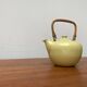 Mid-century ceramic teapot with bamboo handle, 1960s.