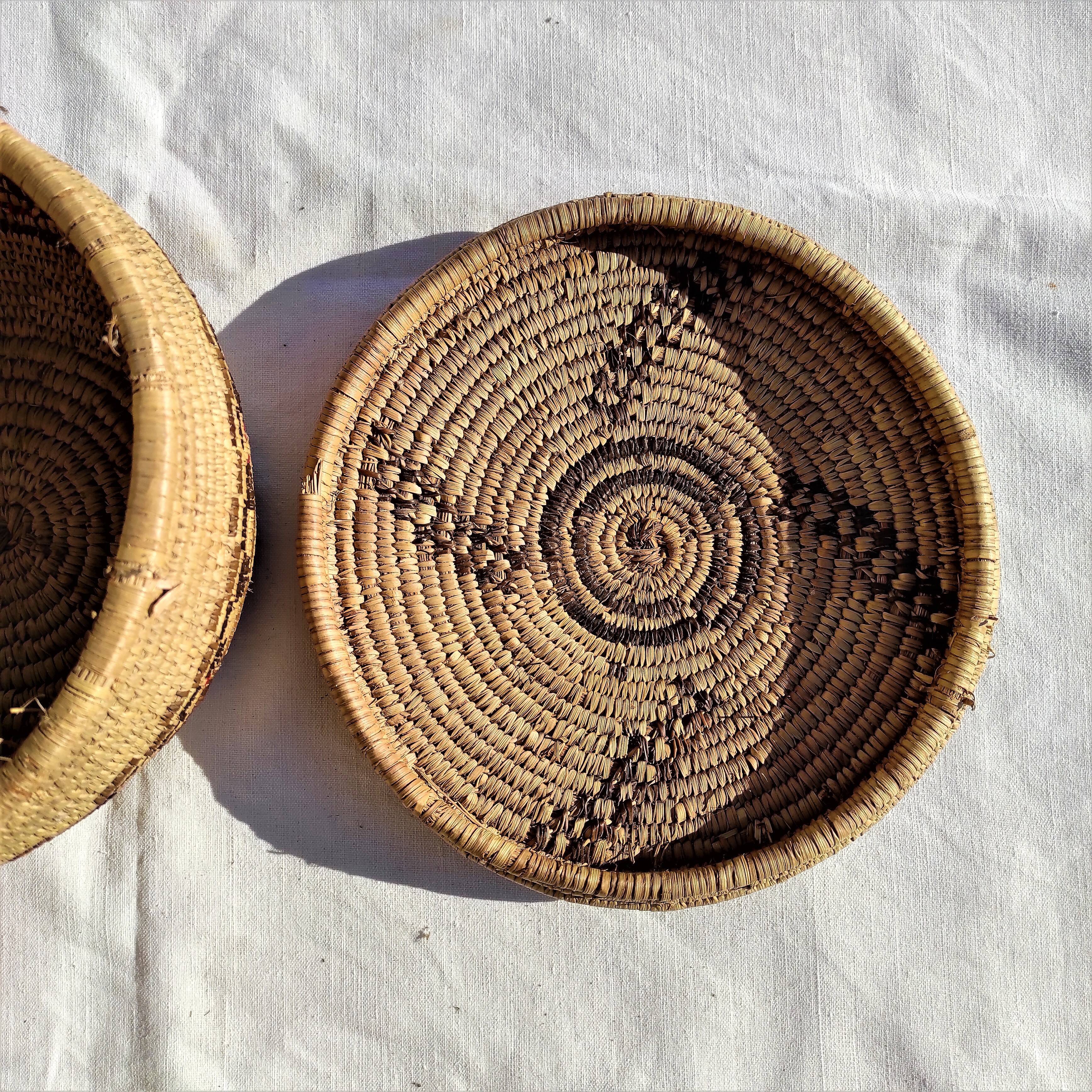 Antique basket with ethnic lid with black/brown and red décor