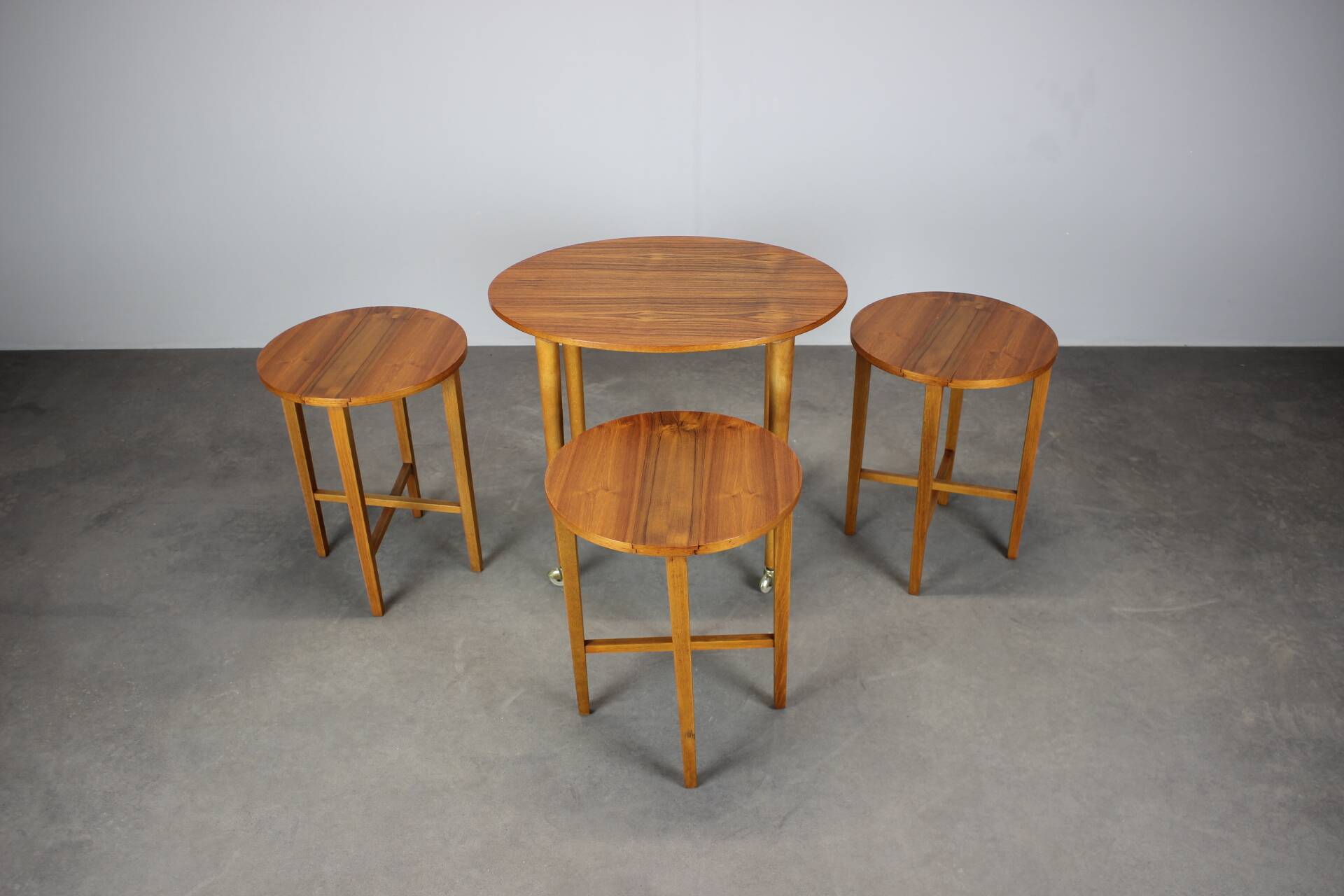 Restored Danish folding teak table with three nesting chairs by Poul Hundevad