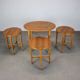 Restored Danish folding teak table with three nesting chairs by Poul Hundevad