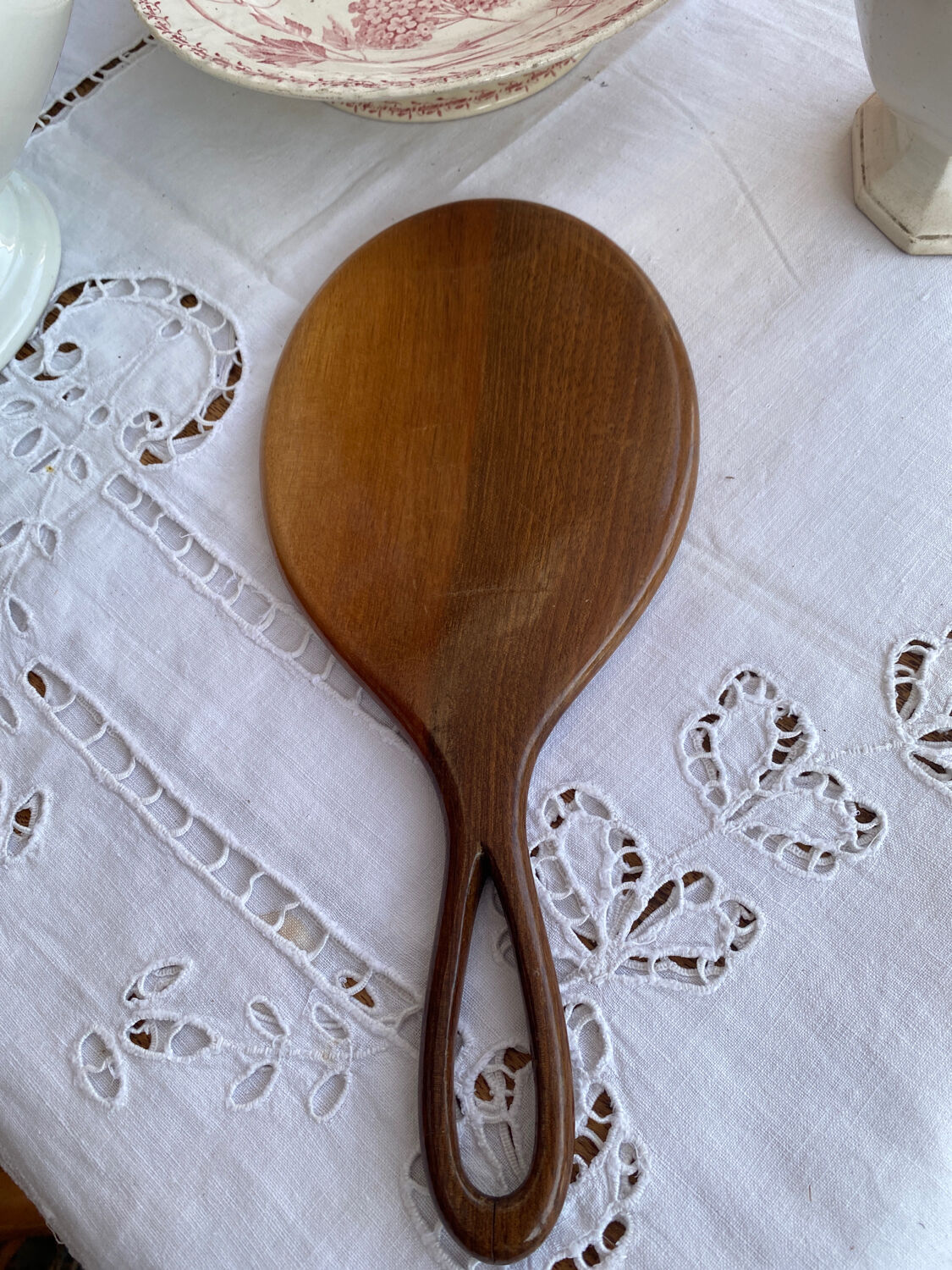 Hand-facing wooden mirror