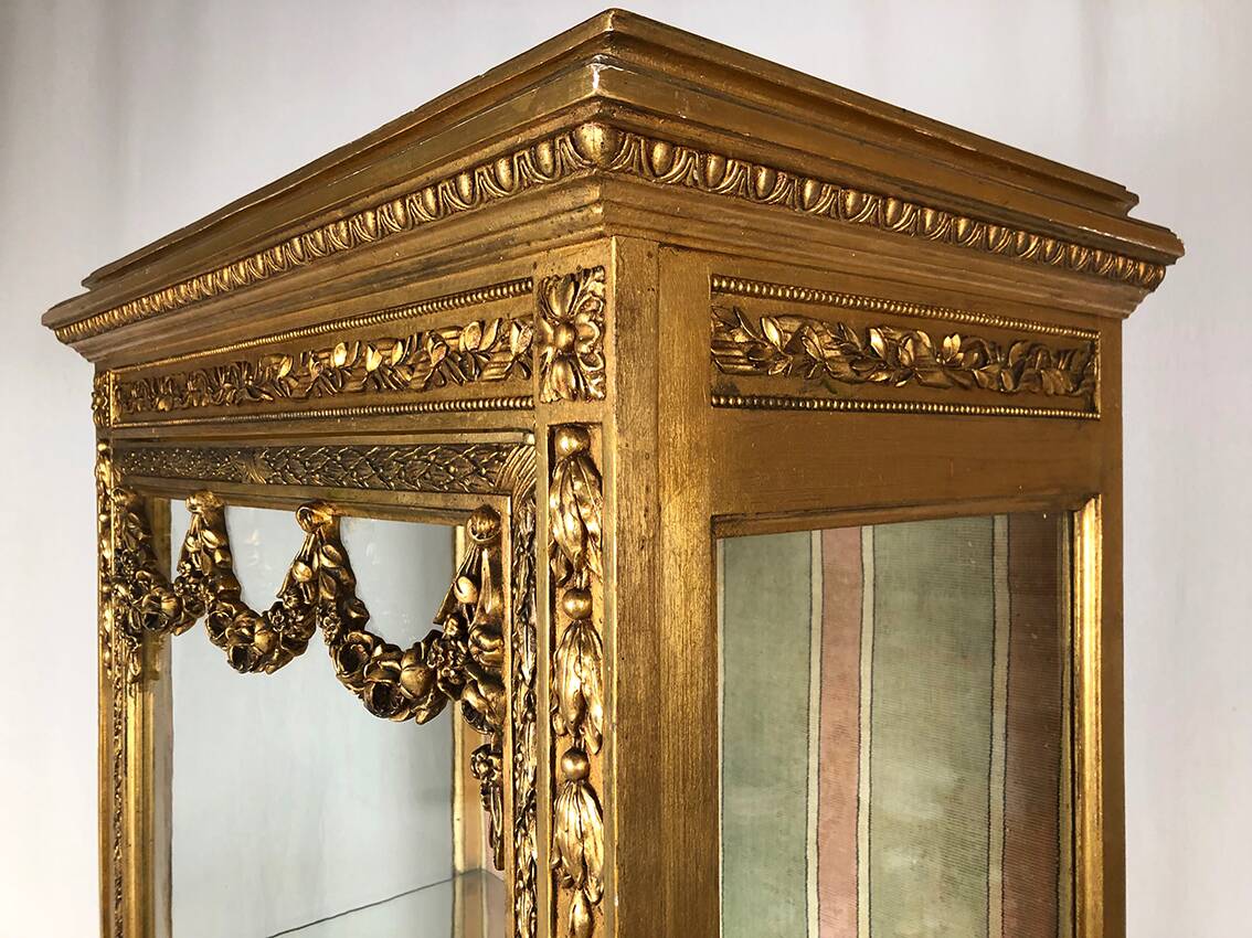 Louis XVI style showcase in wood and gilded stucco, circa 1900