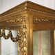 Louis XVI style showcase in wood and gilded stucco, circa 1900